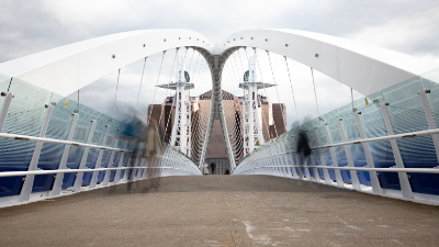 Who doesn't love a bit of symmetry? Long exposure of people crossing the bridge at Media City.