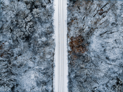 Overhead shot of train tracks after a light dusting of snow